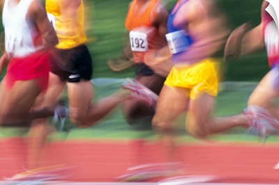 Men running race in track meet