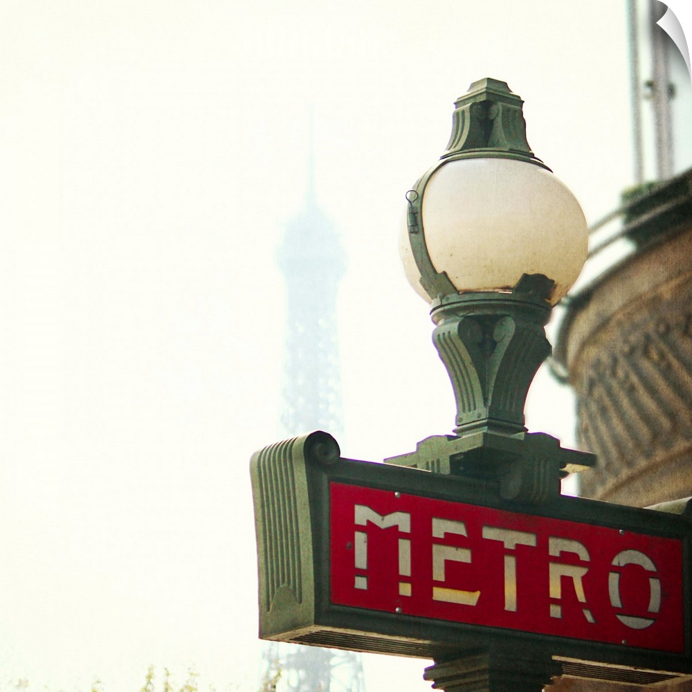 Metro sing in Paris with Eiffel Tower background.