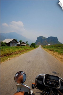 Motorbike driving on open road through northern Vietnam.