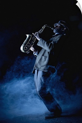 Musician playing saxophone on stage