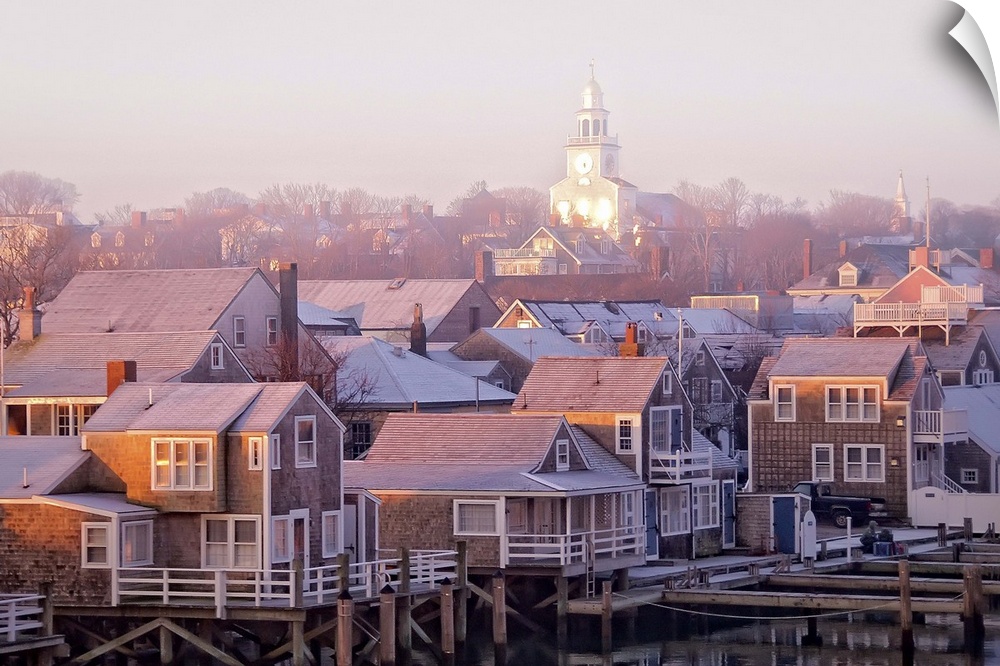 Nantucket town at sunrise in the fog.