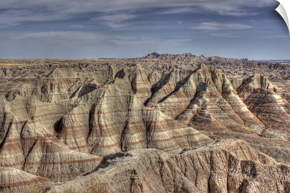 Natural formations in Badlands of South Dakota, showing striations and contours.Hills show erosion and effects of time.