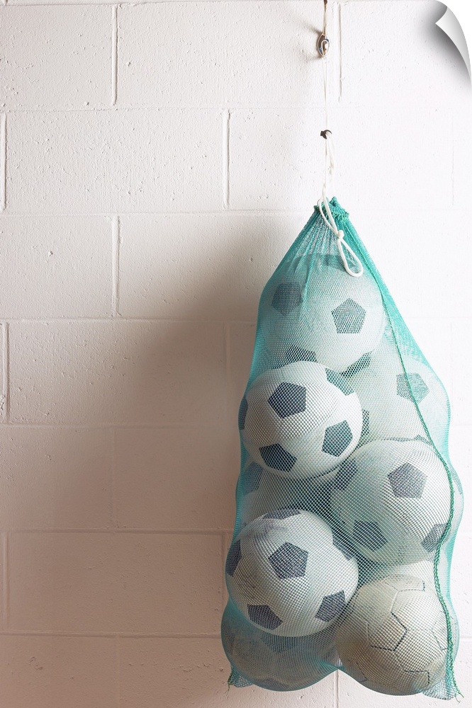 Net Of Soccer Balls On Gym Wall