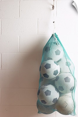 Net Of Soccer Balls On Gym Wall