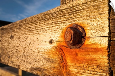 Nut and bolt on a weathered wood wall