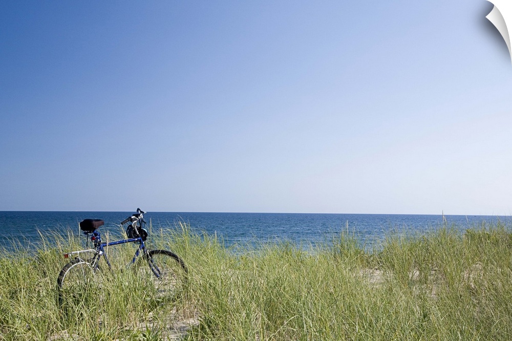 Ocean and horizon with clear blue sky in background.