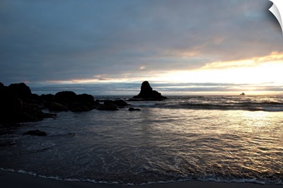 Ocean sunset silhouettes lighthouse