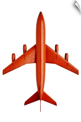 Orange plastic model of an airliner