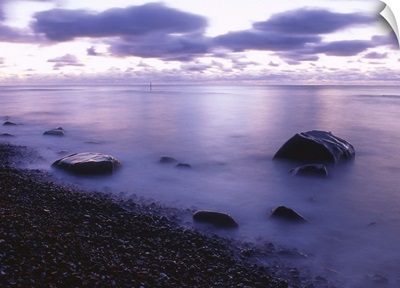 Pebble stone beach at sunrise, Ruegen, Mecklenburg-Western Pomeranian, Germany