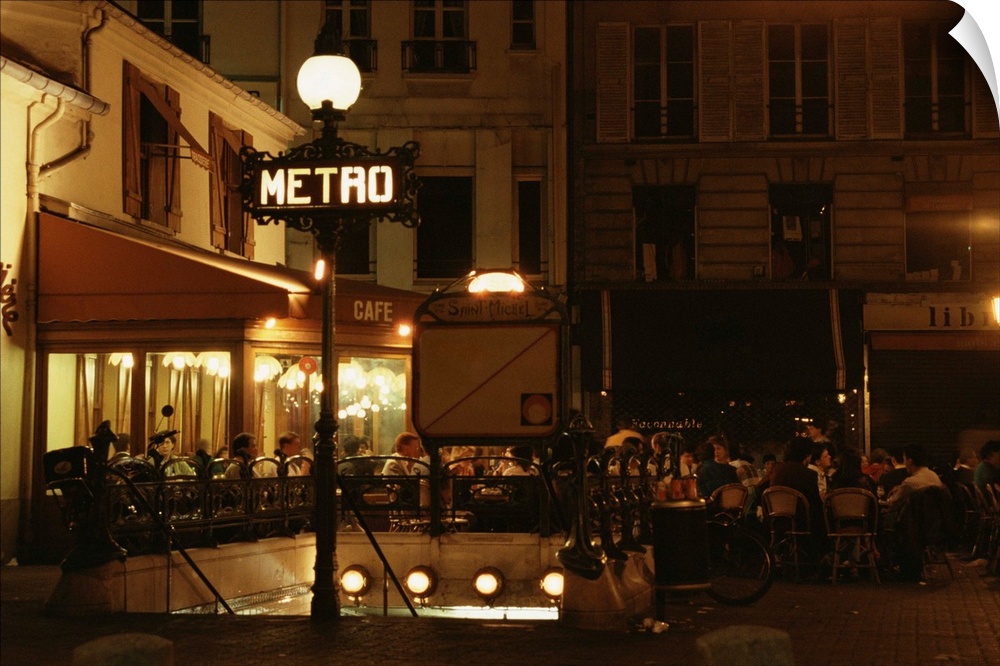 People eating at cafe in Paris at night