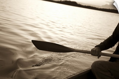 Person canoeing on a lake