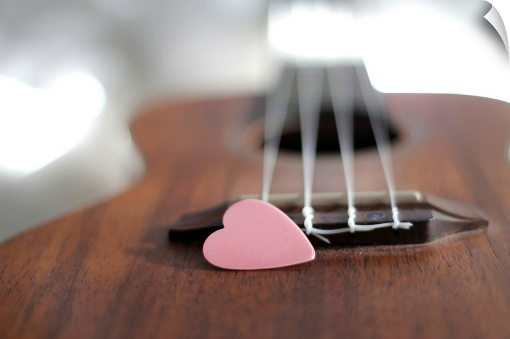 Pink heart on guitar.