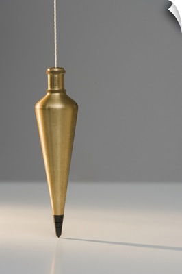Plumb bob suspended from plumb line
