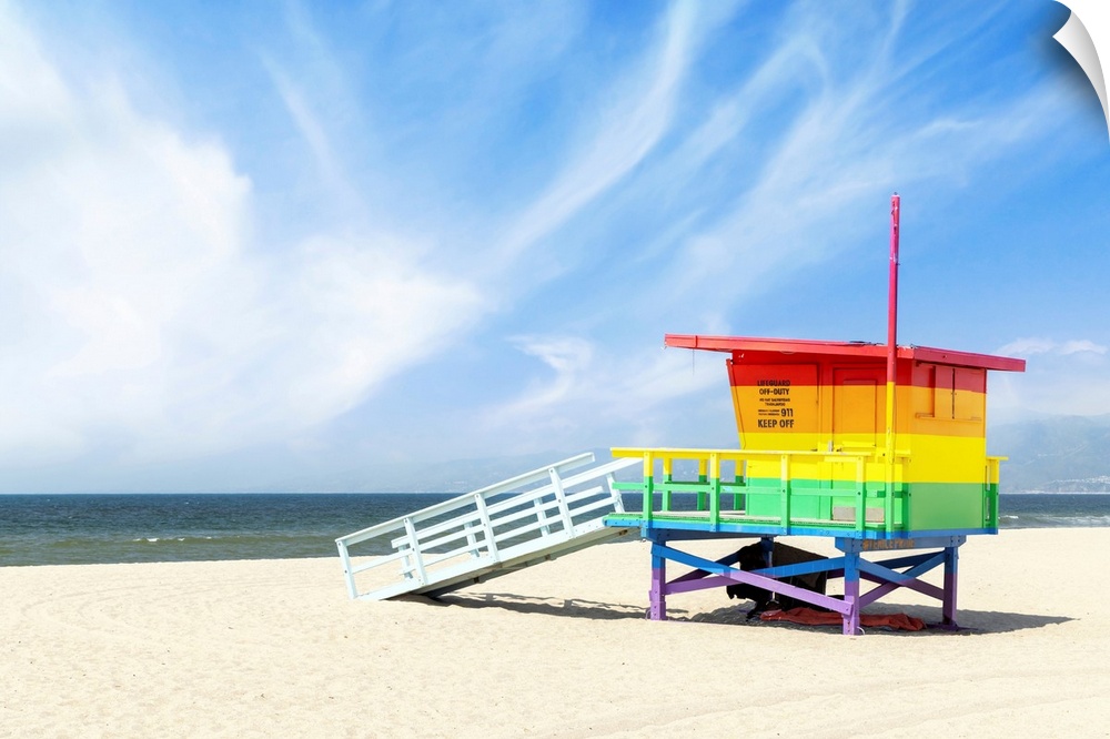 A vibrant photo of a lifeguard tower in the colors of the pride flag, located at Venice Beach, Los Angeles