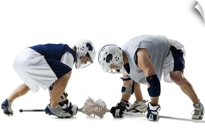 Profile of two young men playing lacrosse