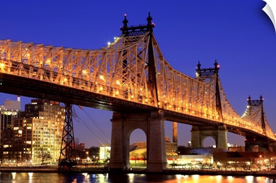 Queensboro Bridge and the East River at night, New York.