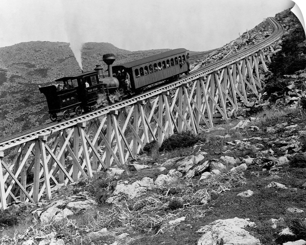 A locomotive pushes a passenger car up Jacob's Ladder, a steep railroad bridge on Mount Washington in New Hampshire. 1895.