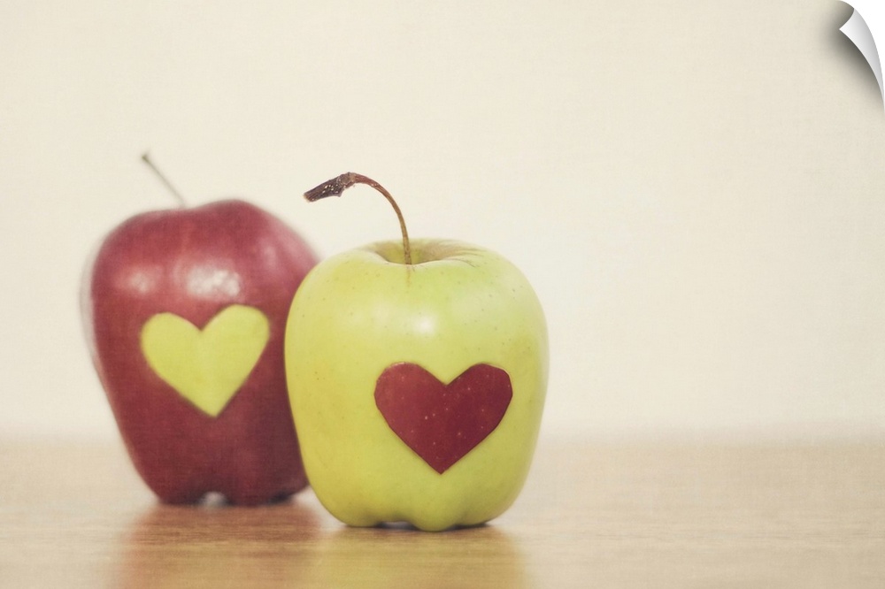 Red and green apple with heart shape.