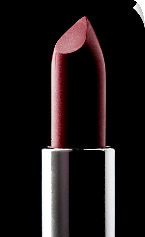 Red lipstick against black background, close-up