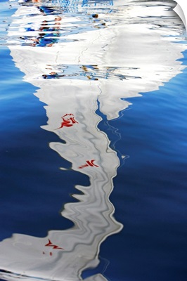 Reflection of sailboat on water