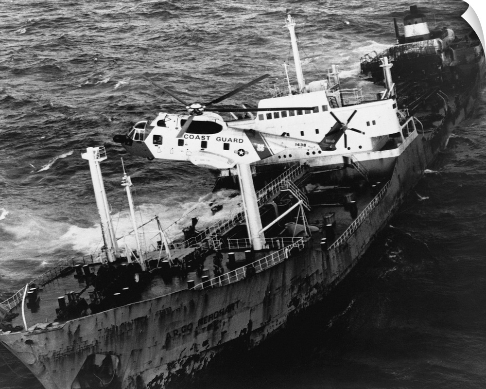 A Sikorsky HH-3F Pelican hovers over the Argo Merchant oil tanker during a rescue operation. The U.S. Coast Guard was call...