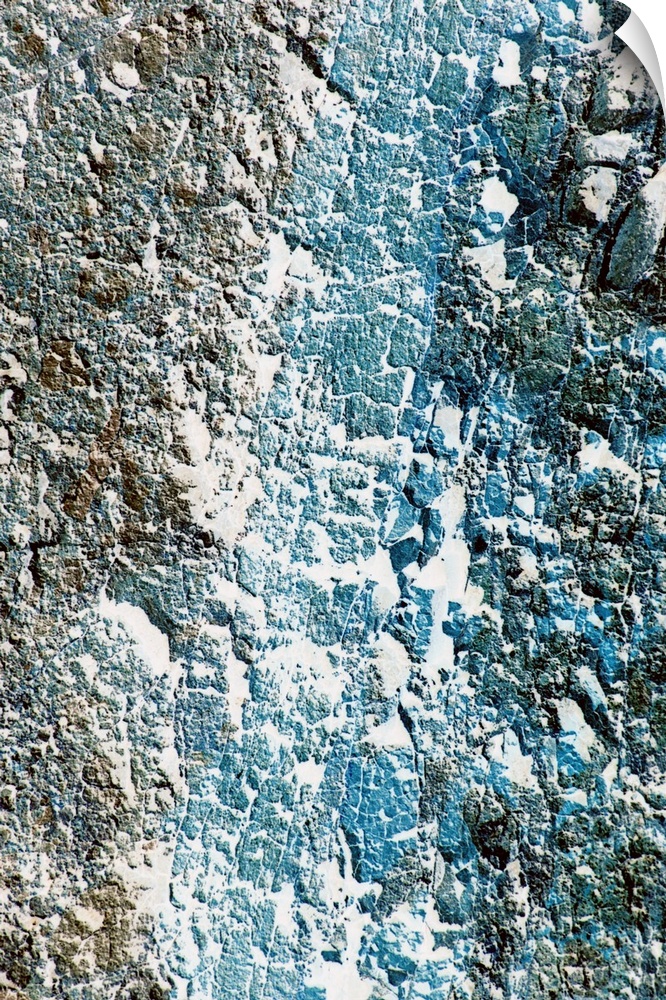 Tall printed canvas of the up close of a rock wall.