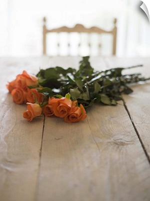 Roses on wooden table