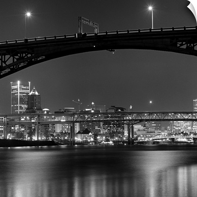 Ross Island bridge at night with city of Portland, Oregon in background, US.