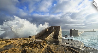 Rough seas crashing against one of Malta's most prominent breakwater.