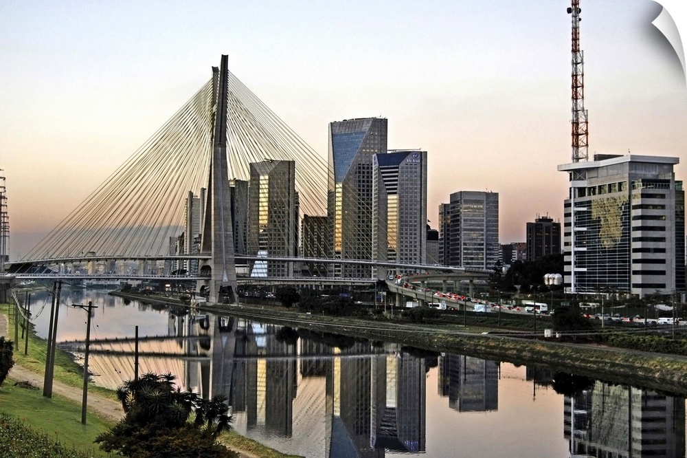 Sao Paulo landmark at dusk. Octavio Frias de Oliveira Stayed Bridge and modern buildings and districts of the skyline.