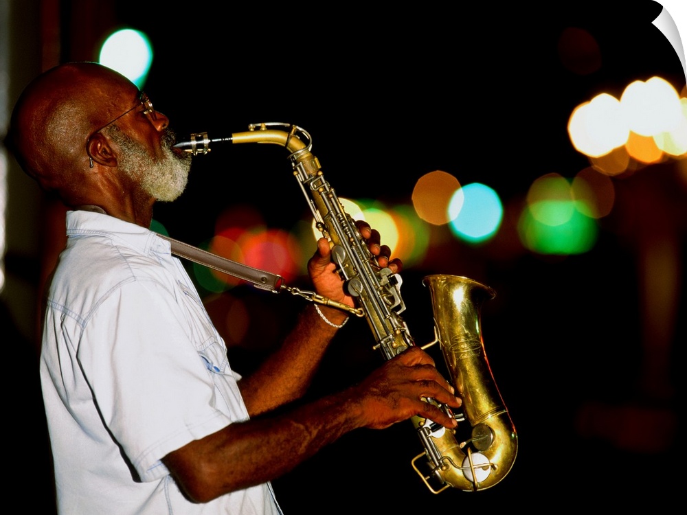 Saxophonist on street at night, New Orleans, Louisiana, USA