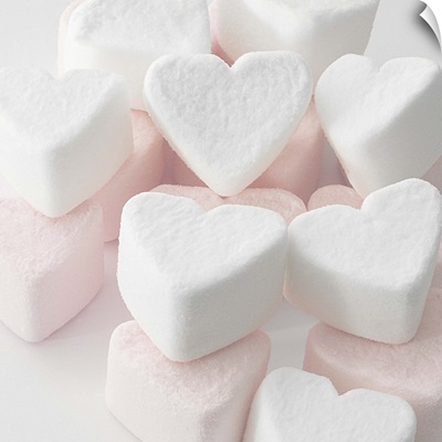 Selection of pink and white heart shaped marshmallows.