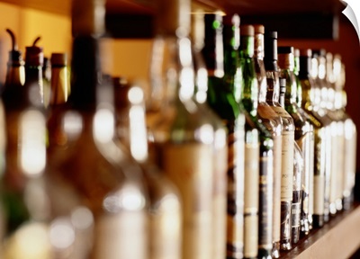 Shelf of liquor bottles (differential focus