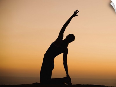Silhouette of person stretching
