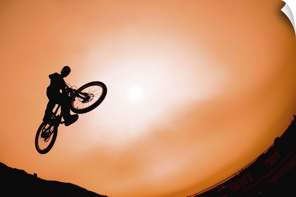 Silhouette of stunt cyclist