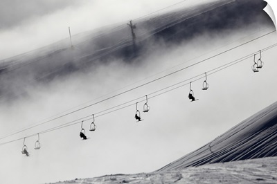 Skiers on a chair lift