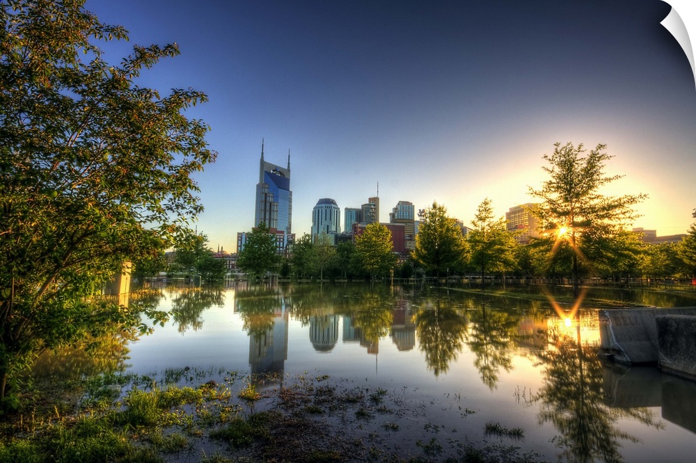 Skyline of Nashville reflection in water at sunset.