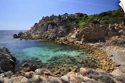 Small deserted beach with clear turquoise water. Mediterranean sea, Corsica, France.