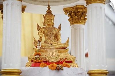 small gold seated thai buddha