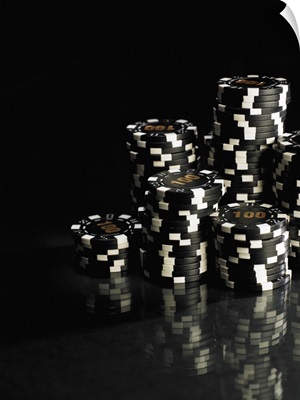 Stacks of black and white gambling chips, close-up