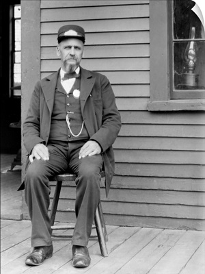 Station Master Sits At The Train Depot, Ca. 1900