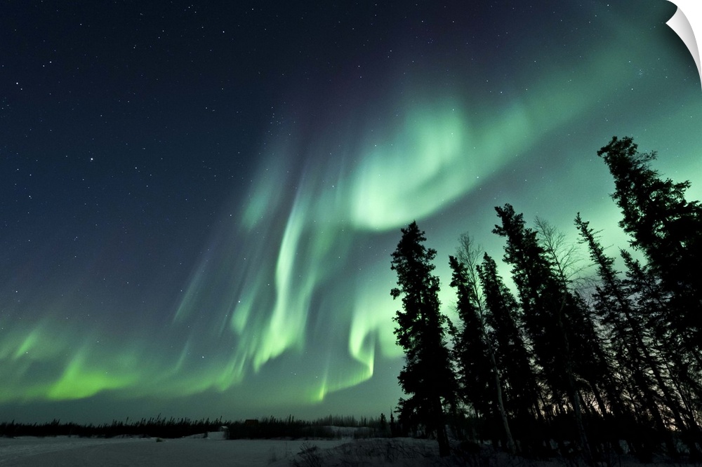 Strong aurora over Walsh Lake, Northwest Territories, Canada.