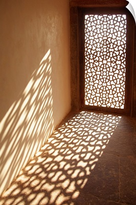 Sunlight coming through decorative window at Red Fort palace.