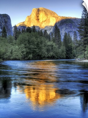 Sunset on half Dome reflecting in Merced river in Yosemite National Park.