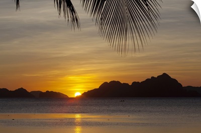 sunset view of tropical islands from the beaches of corong corong