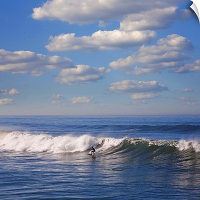 Surfer riding big wave in Ocean beach, California.