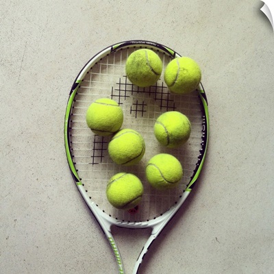 Tennis racquet and tennis balls.