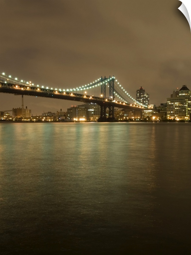 The Manhattan Bridge, the DUMBO neighborhood of Brooklyn and the East River at Night, Viewed from the East River Esplanade...