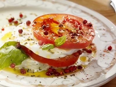 Tomatoes with mozzarella on plate, close-up