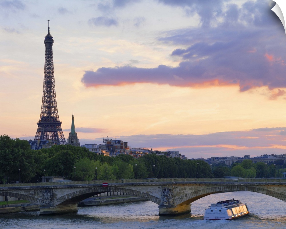 France,Paris,tour boat on River Seine,Eiffel Tower behind at dusk